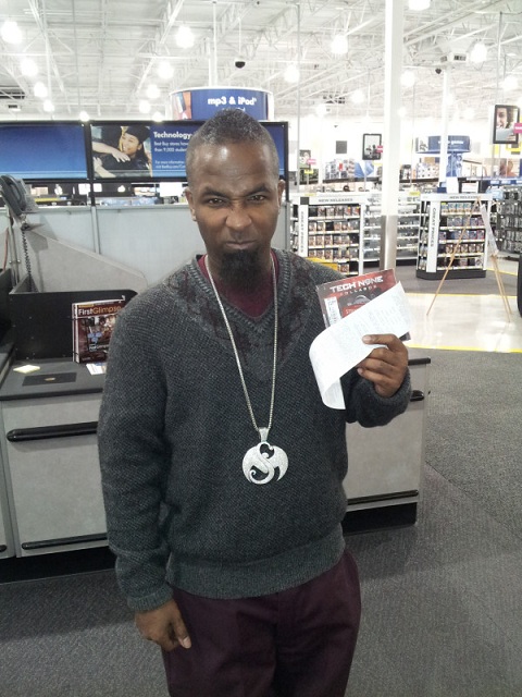 Tech N9ne Poses With His Album And Receipt At Best Buy